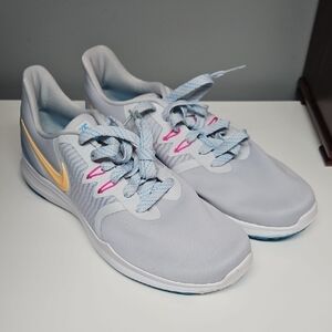 Nike Women's Gray Sneakers with Pink and Yellow Accents
